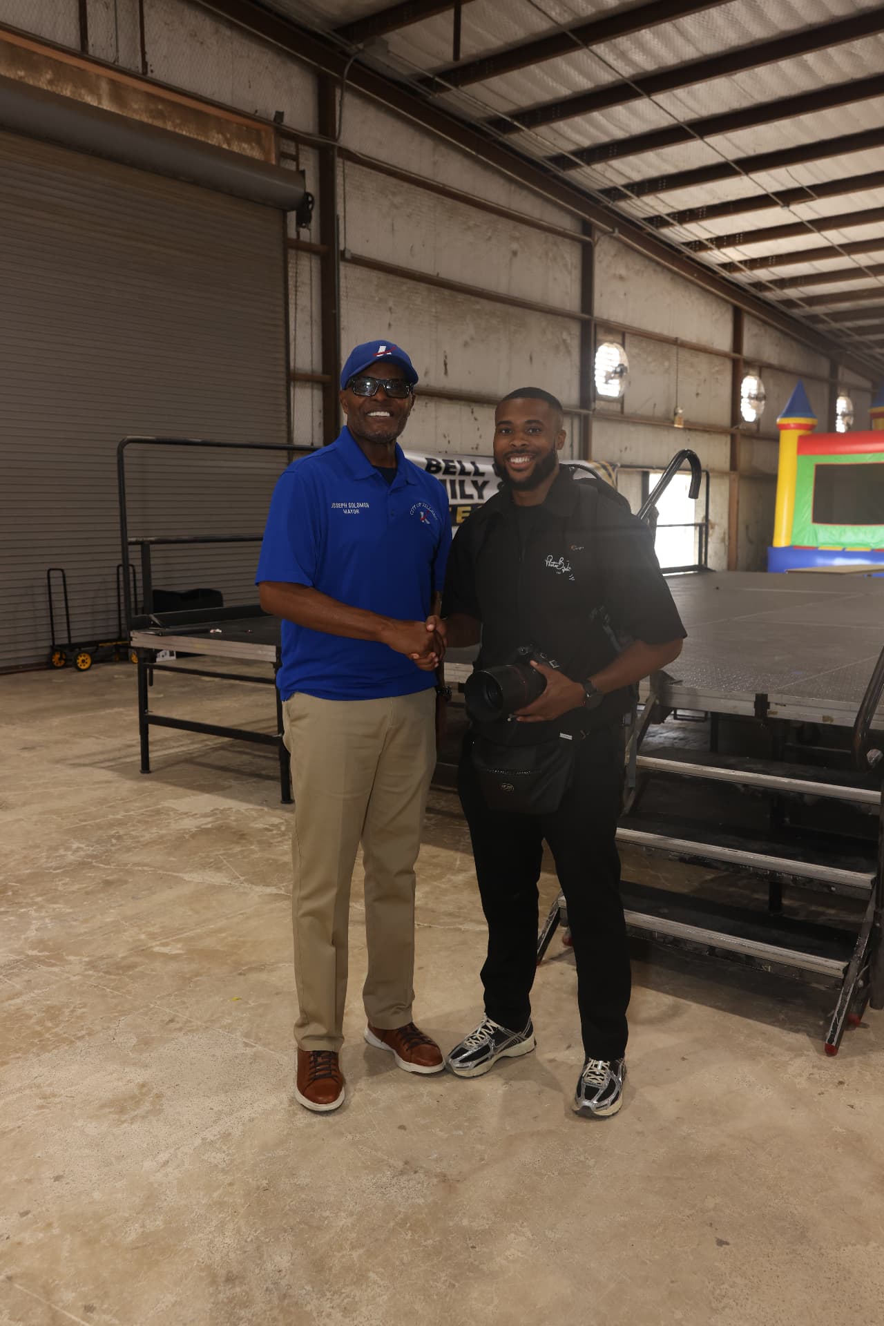 Mayor Joseph Solomon shaking hands with the PhotosByIvan photographer.