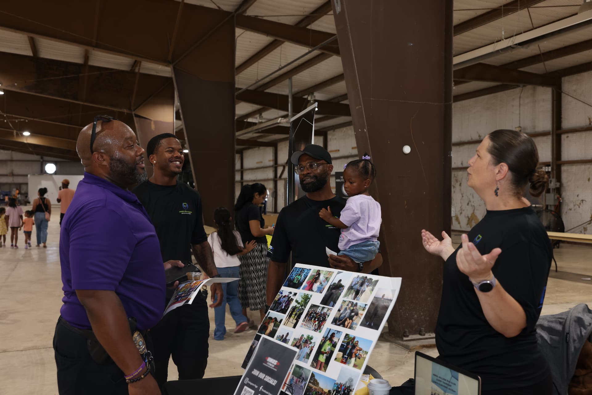 HWDS Foundation team talking with attendees at their booth.
