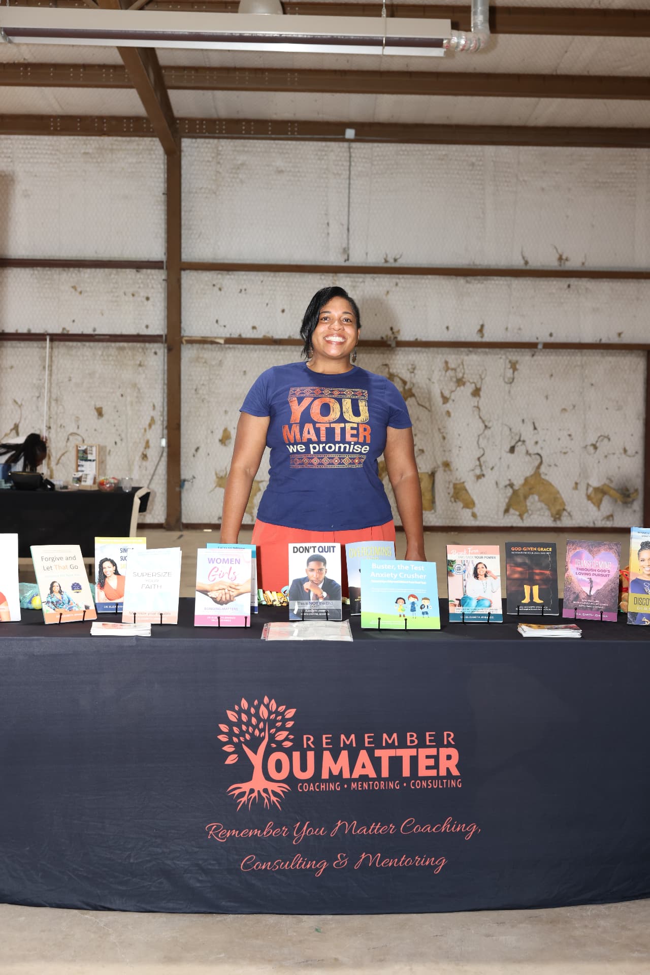 Remember You Matter founder at her table of books and resources.