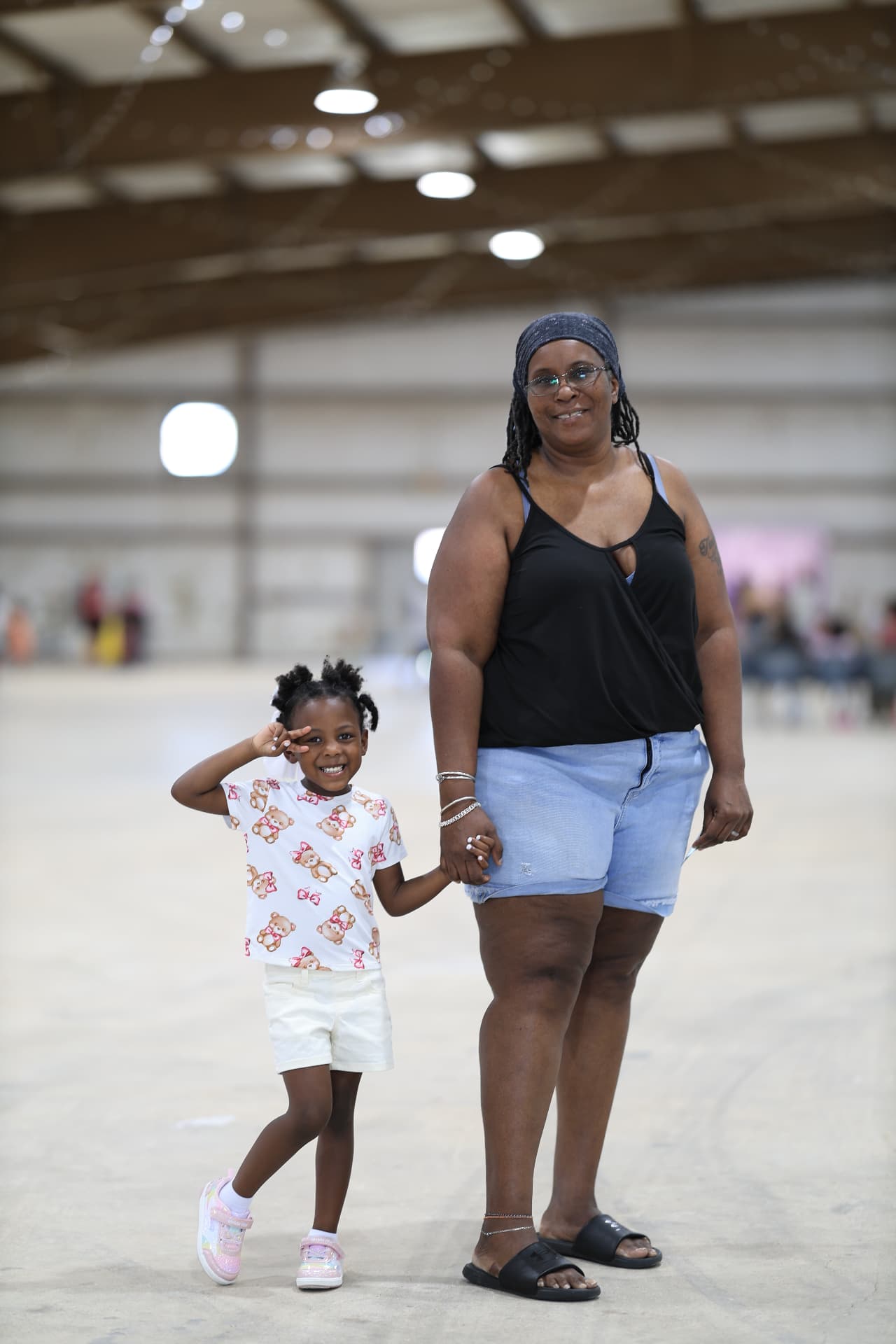 A grandmother and granddaughter posing together at the festival.