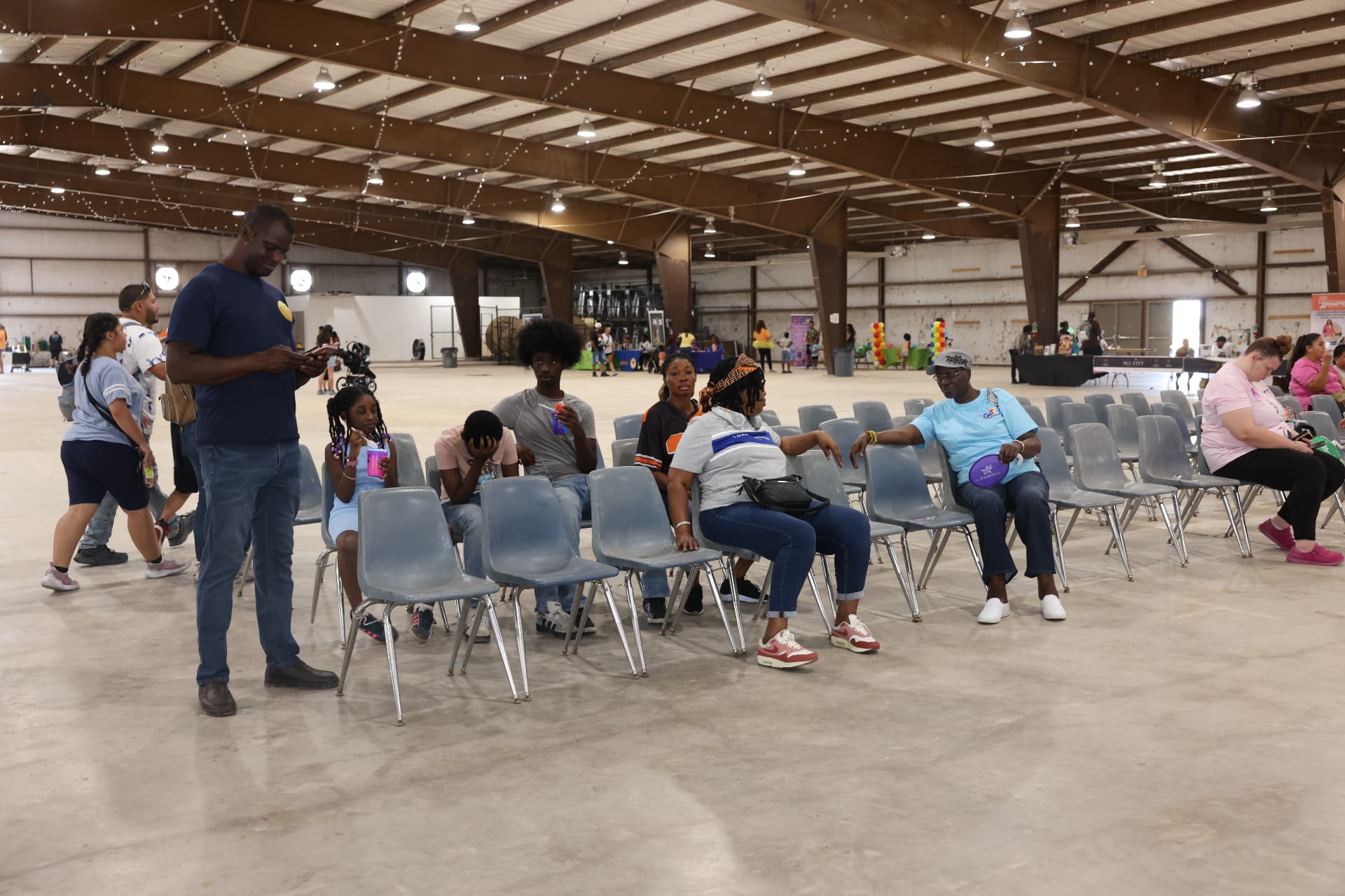 Families seated in the main hall waiting for the stage program.