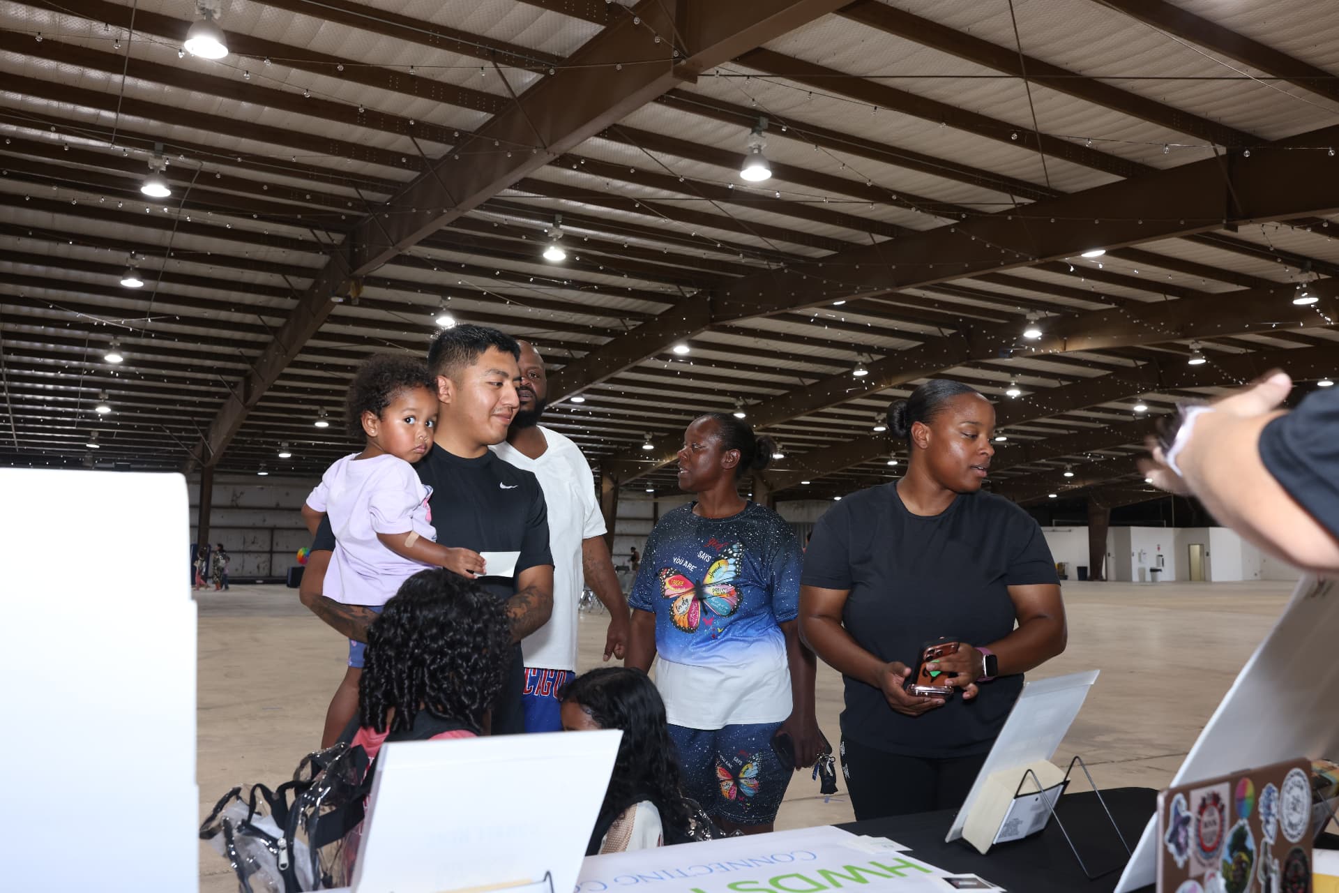 Families gathered at the HWDS Foundation resource table.