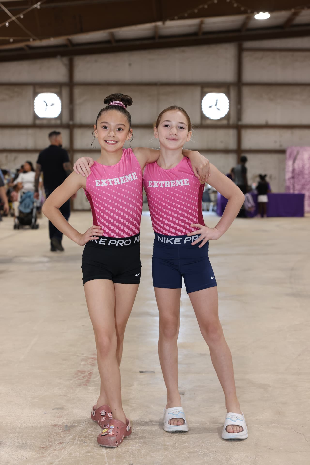 Two young Extreme gymnasts posing together before their performance.