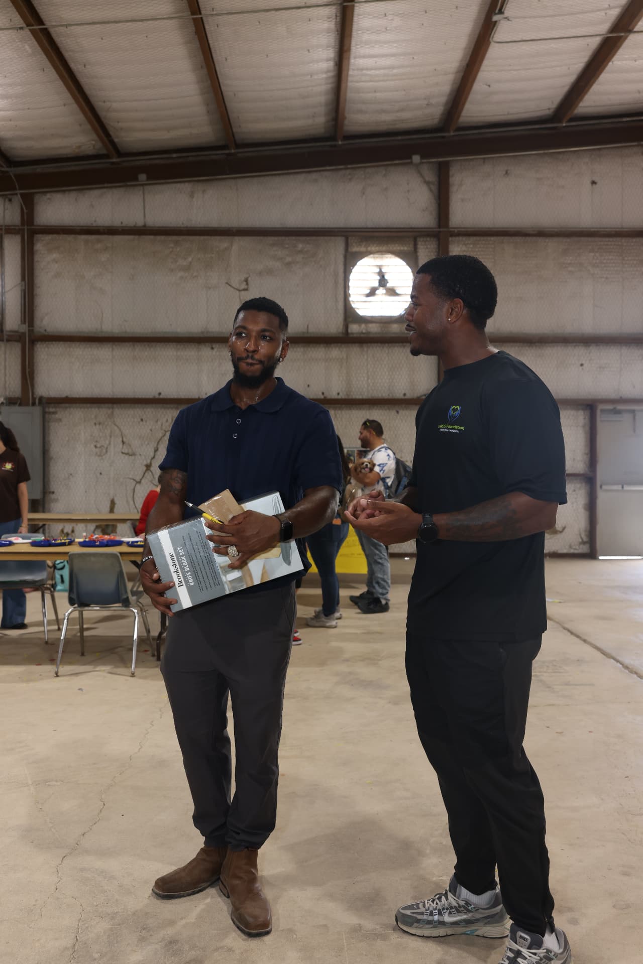 Festival organizer talking with an HWDS Foundation volunteer.