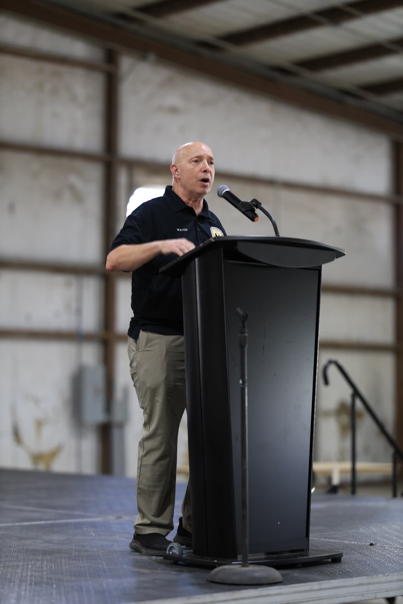 Army Community Service speaker addressing the crowd from the stage.
