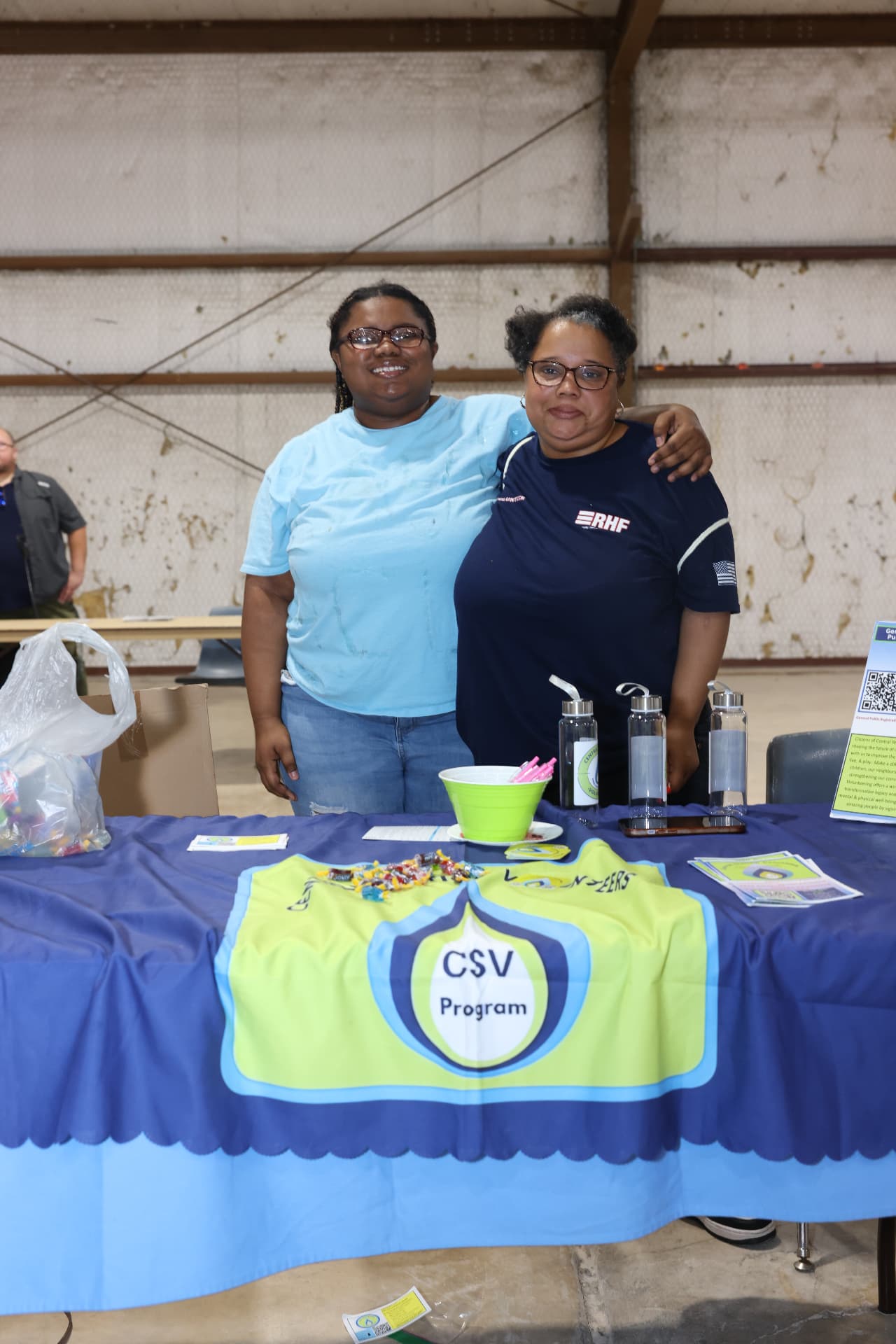 Two CSV Program volunteers at their resource table.